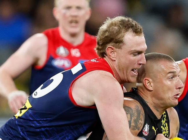 MELBOURNE, AUSTRALIA - APRIL 24: Dustin Martin of the Tigers is tackled by Harrison Petty of the Demons during the 2024 AFL Round 07 match between the Richmond Tigers and the Melbourne Demons at the Melbourne Cricket Ground on April 24, 2024 in Melbourne, Australia. (Photo by Dylan Burns/AFL Photos via Getty Images)
