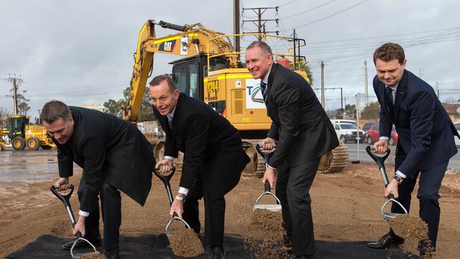 The-then assistant federal infrastructure minister Jamie Briggs, the-then prime minister Tony Abbott, the-then premier Jay Weatherill and the-then urban development minister Stephen Mullighan turn the first sods on the South Rd expansion project at Croydon in August, 2015. Picture: AAP Image / Ben Macmahon