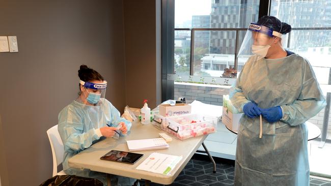 Healthcare staff get their daily COVID test. Picture: Andrew Henshaw