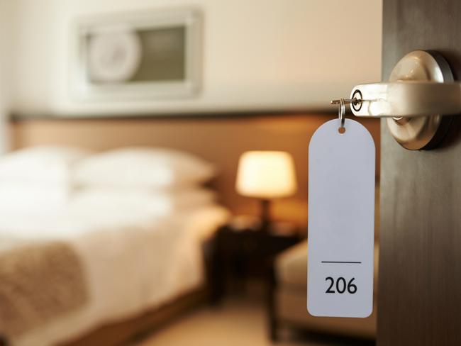 Opened door of hotel room with key in the lock. Picture: iStockFAQ What to do when ... Sarah Nicholson, Escape