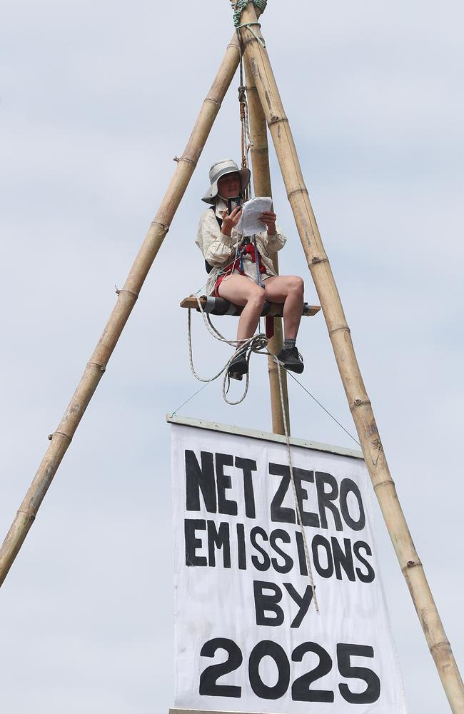 An Extinction Rebellion protestor blocks traffic on the Hale Street exit. Picture: Peter Wallis