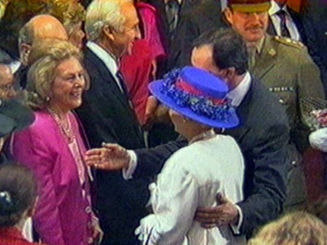 The touch that shocked a nation — Paul Keting puts his arm around Queen Elizabeth.