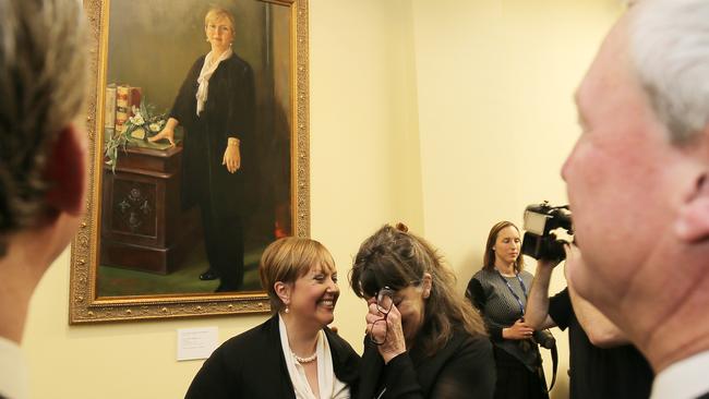 Premier Will Hodgman, far left, and Opposition Leader Bryan Green, far right, look at the portrait with subject Lara Giddings and artist Deny Christian. Picture: RICHARD JUPE