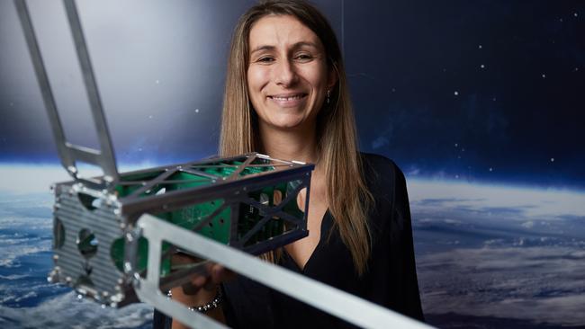 Fleet Space CEO Flavia Tata Nardini with their nano satellite prototype. Picture: AAP / Matt Loxton