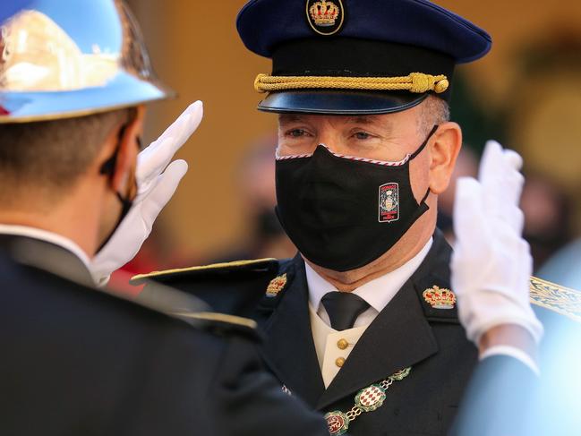 Prince Albert II of Monaco salutes as he attends the celebrations marking Monaco's National Day at the Palace in Monaco, on November 19, 2020. (Photo by Valery HACHE / POOL / AFP)