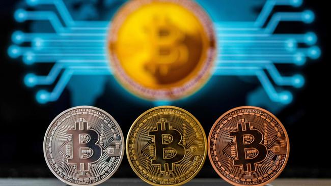 With central banks pledging this year to push up inflation, more investors have been willing to test bitcoin as a hedge. Picture: AFP