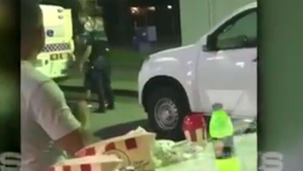 Police arrest the man as other diners look on. Picture: 7 News Brisbane