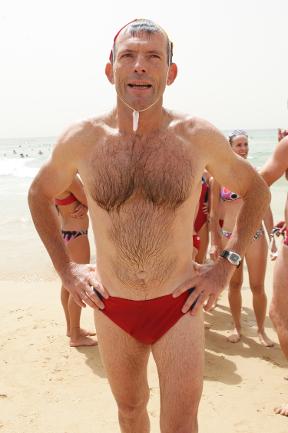 <p>Tony Abbott in the now famous budgie smuglers. Picture: Jim Trifyllis</p>