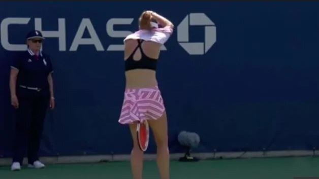 Alize Cornet taker off her top at the US Open