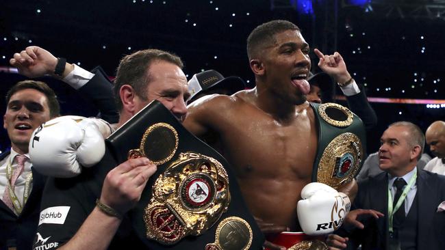 British boxer Anthony Joshua, centre, celebrates winning against Ukrainian boxer Wladimir Klitschko. Picture: AP