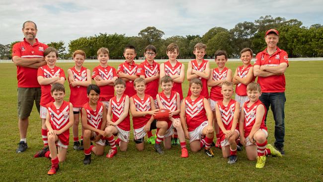 SUPER SQUAD: The coaches and the talented U10.5 players of the Lismore Swans Junior Australian football Club.