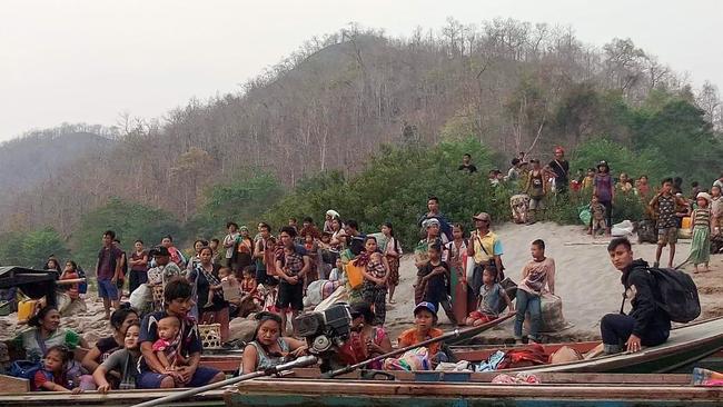 Karen people cross Salween river into Thailand to seek refuge after airstrikes. Picture: AFP