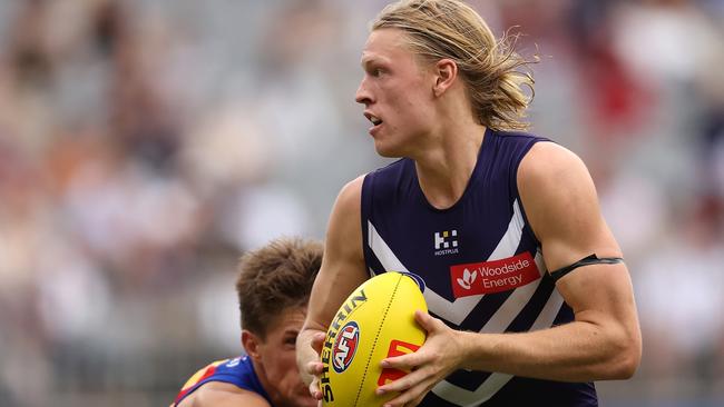 PERTH, AUSTRALIA - MARCH 17: Hayden Young of the Dockers in action during the round one AFL match between Fremantle Dockers and Brisbane Lions at Optus Stadium, on March 17, 2024, in Perth, Australia. (Photo by Paul Kane/Getty Images)