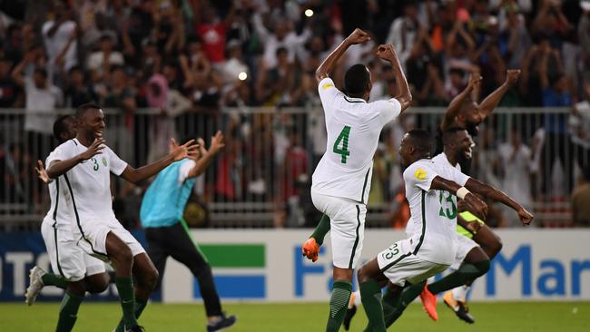 Saudi Arabia players celebrate their 1-0 victory against Japan and qualification for the World Cup. Photo: Getty Images