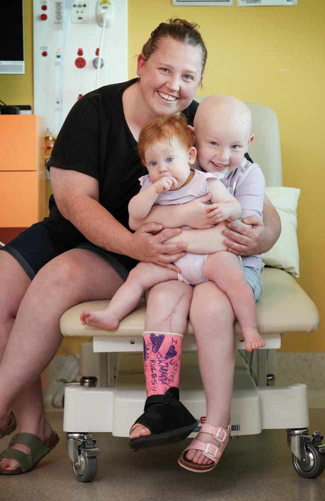 Mia with her mum Nicole Depuit and little sister Maisy. Picture: David Caird