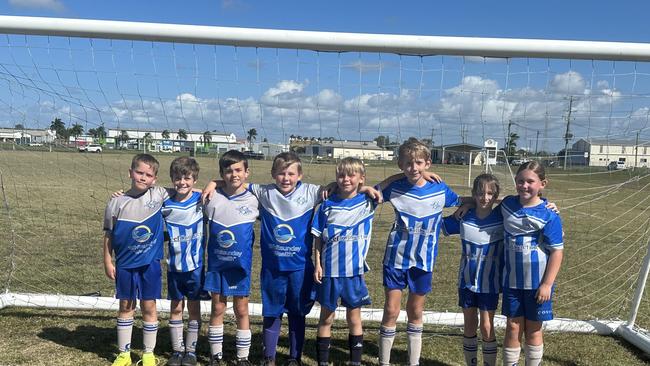 Dolphins FC players (from left) Ashton Jennings, Emmitt Riley, Kobe Randell, Connor Hancock, Lively Franettovich, Max Flavell, Maggie Daly, Chelsea Grogan celebrate being named Mackay Whitsundays Team of the Week.