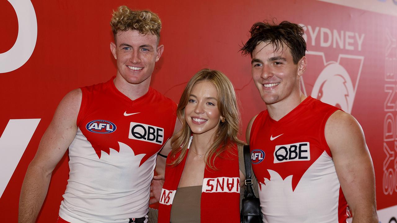 Euphoria actor Sydney Sweeney (centre, with Swans midfielders Chad Warner, left, and Errol Gulden, right, beside her) was among the traditional host of stars and socialites at the Swans’ first home game of the year. Photo by Phil Hillyard