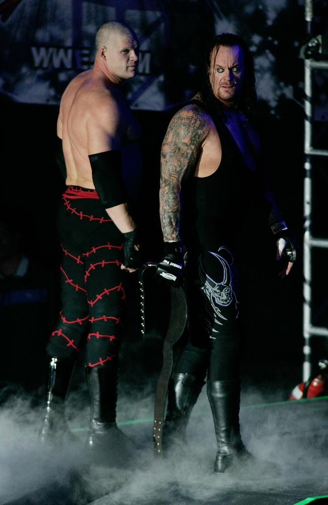 undertaker with kane mask