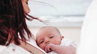 Kingsley with his mum at the beach. Picture: Zara Robinson