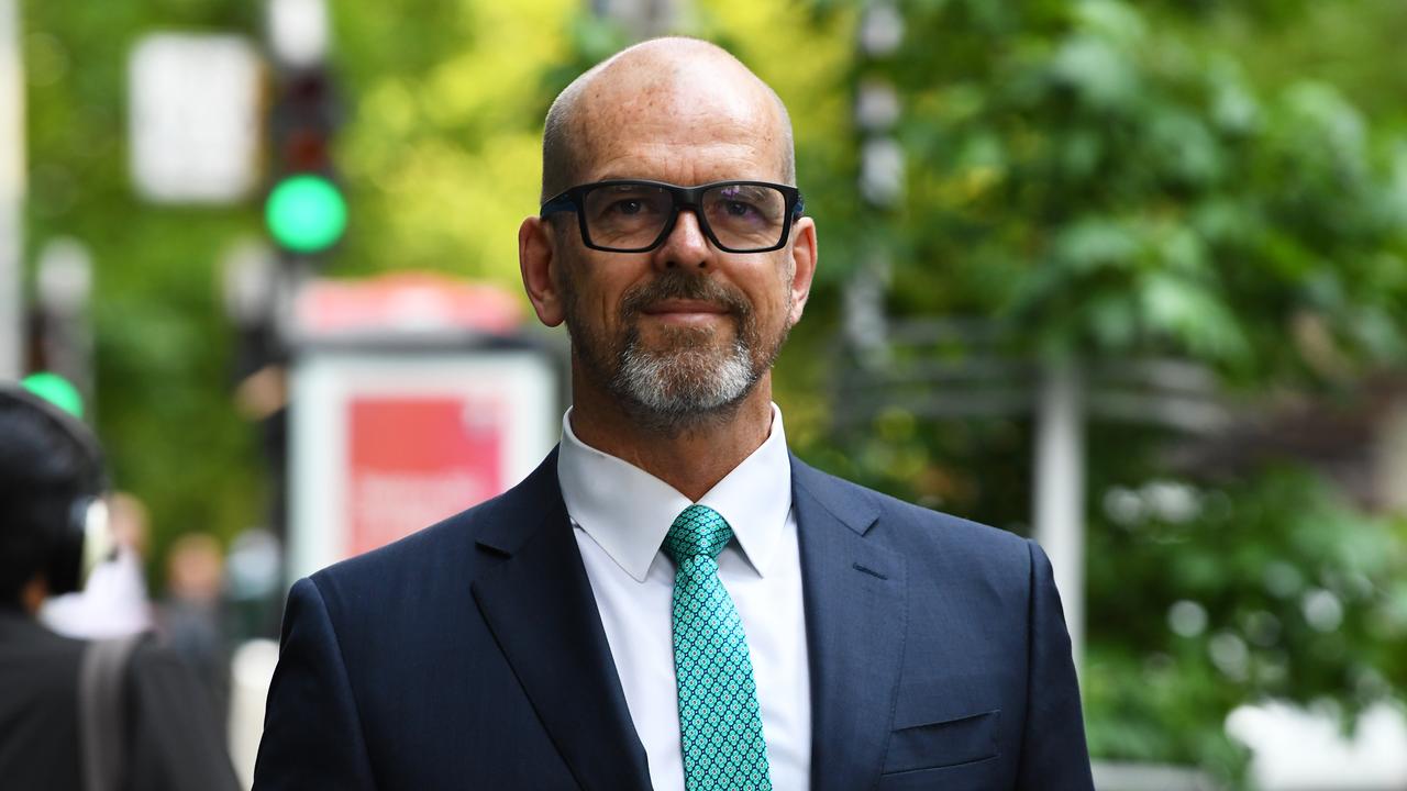 Former Victoria Police Chief Commissioner Simon Overland arrives to the Royal Commission into the Management of Police Informants at the Fair Work Commission in Melbourne, December 17, 2019. (AAP Image/James Ross)