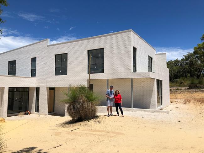 The home’s elongate shape is set deep into the site.