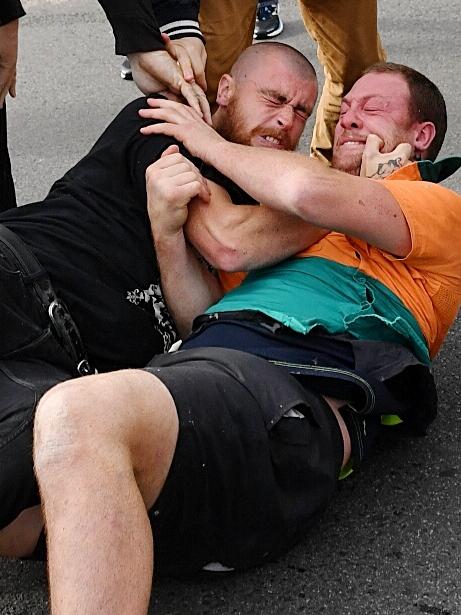Protesters fight outside the show. Picture: Jake Nowakowski