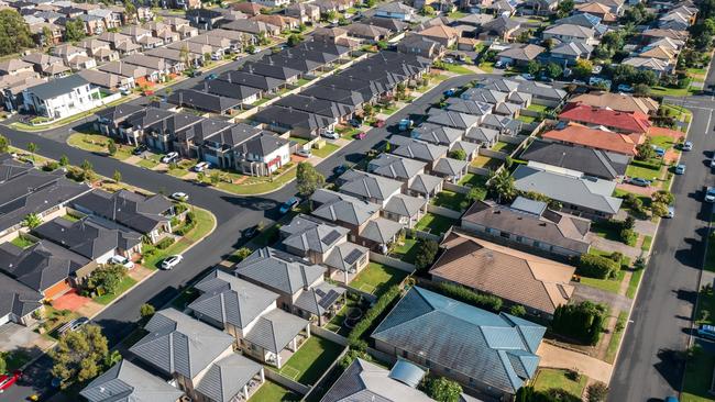 Aerial view of rows of mass produced 'cookie cutter' style homes build during the 2010s in outer suburban Sydney, Australia.