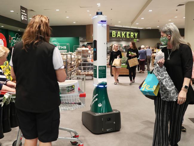 Customers look on as Ex inspects the store. Picture: Sue Graham