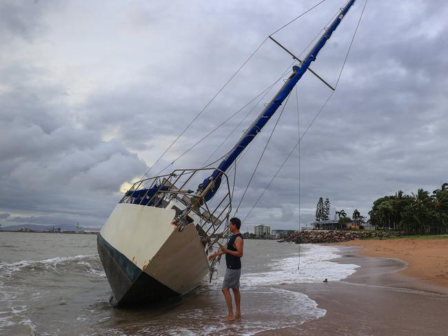 Townsville locals including Dr Deepak Doshi woke early to inspect the damage along The Strand left from TC Kirrily that hit overnight. Pics Adam Head