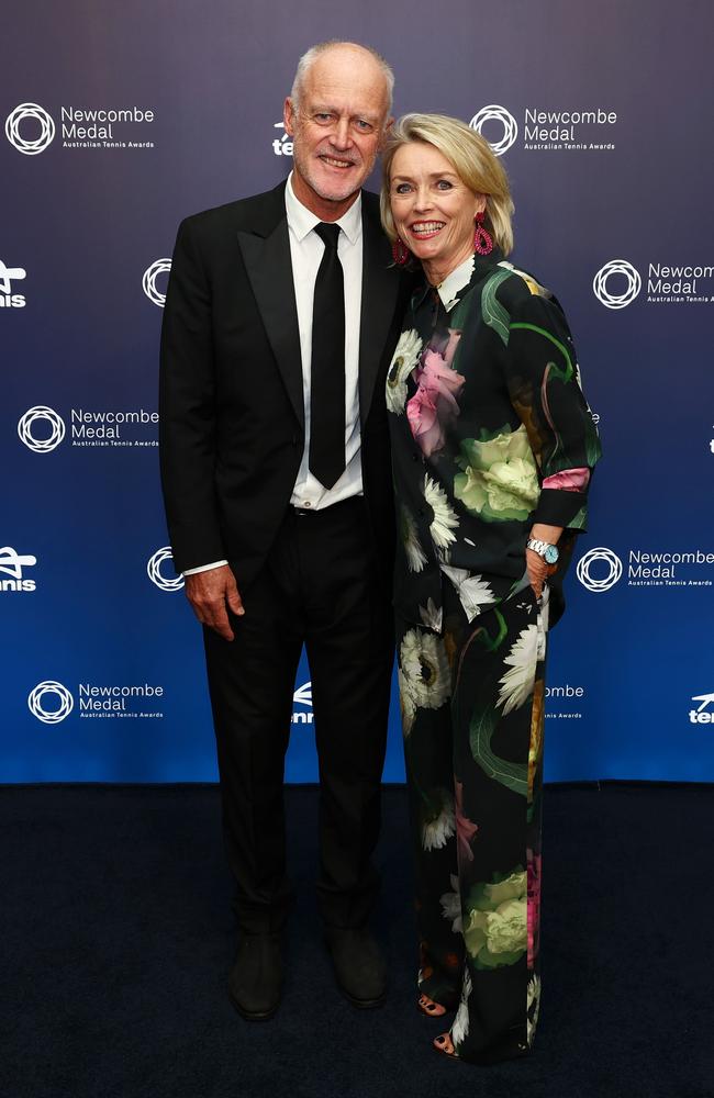 John Fitzgerald and Jenny Fitzgerald pose for a photo on the blue carpet. (Photo by Graham Denholm/Getty Images for Tennis Australia)