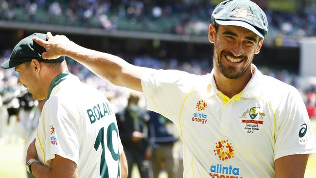 Mitchell Starc congratulates Scott Boland after the debutant’s man of the match performance. Starc was later hailed by skipper Pat Cummins as an all-time great Picture: Getty Images