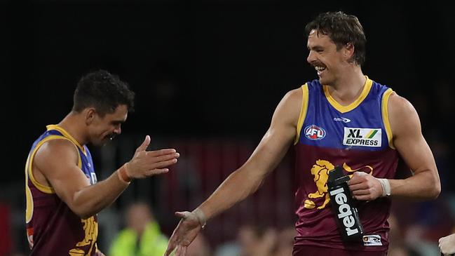 Joe Daniher celebrates a goal with Charlie Cameron. Picture: Jono Searle/AFL Photos/via Getty Images