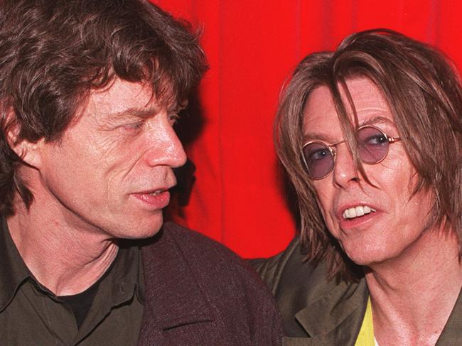 LONDON - DECEMBER 2: Singers David Bowie (R) and Mick Jagger (L) at POP in Soho, London on December 2, 1999. They were attending the aftershow party for Bowie's gig at the Astoria that evening. (Photo by Gareth Davies/Getty Images)