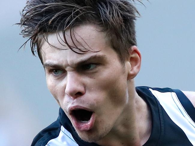 MELBOURNE, AUSTRALIA - MARCH 31: Josh Thomas of the Magpies celebrates a goal during the 2018 AFL round 02 match between the Collingwood Magpies and the GWS Giants at the Melbourne Cricket Ground on March 31, 2018 in Melbourne, Australia. (Photo by Adam Trafford/AFL Media/Getty Images)