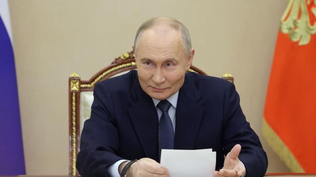 Vladimir Putin in a televised meeting with military chiefs on Friday. Picture: Gavriil Grigorov / POOL / AFP