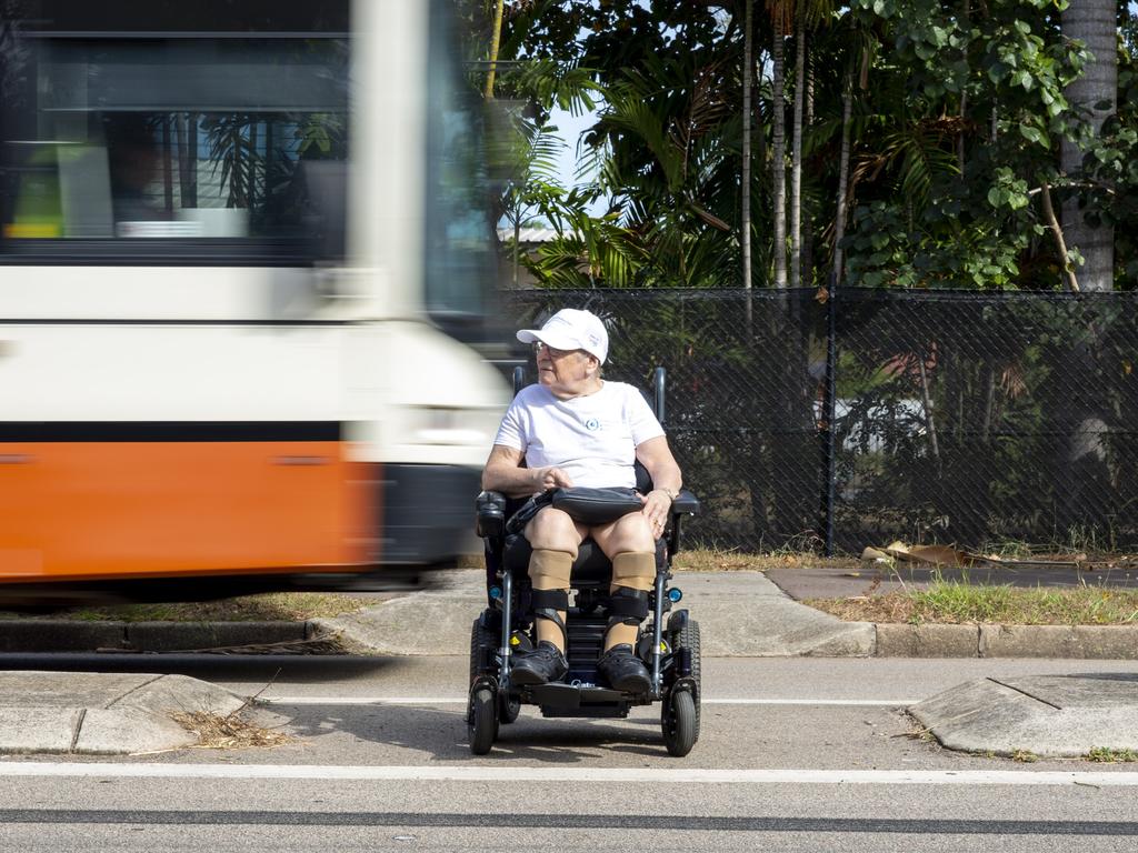 Ms Burridge prepares to carefully cross the road and avoid the traffic on the busy Dick Ward Dr in Coconut Gove. Picture: Floss Adams.