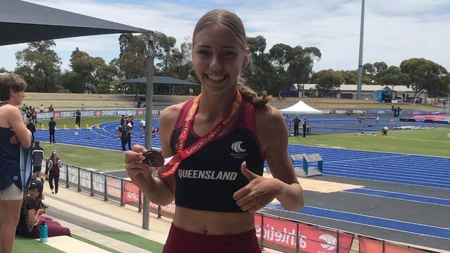 Kayce Hoani-Vince proudly holding her bronze medal from the under-16 women’s pole vault at the National All-Schools Championships.