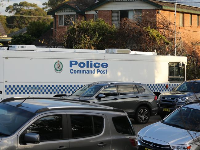 AFP officers outside a property in Toongabbie during Tuesday’s raids. Picture John Grainger