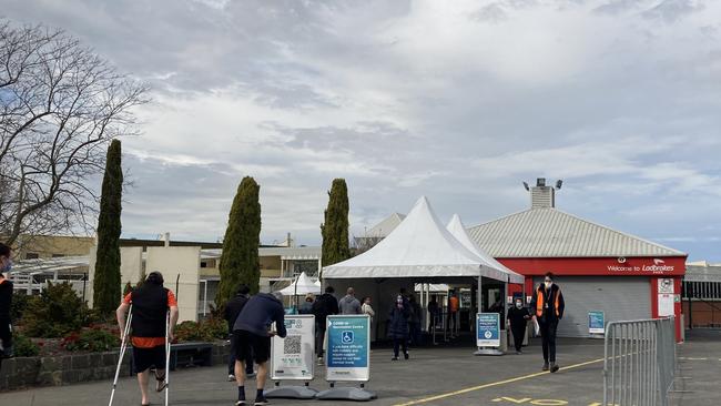 Punters made their way through the gates at Sandown Racecourse for a different purpose on Monday, as the state government widened the AstraZeneca eligibility to all adults under 40 at state-run hubs.