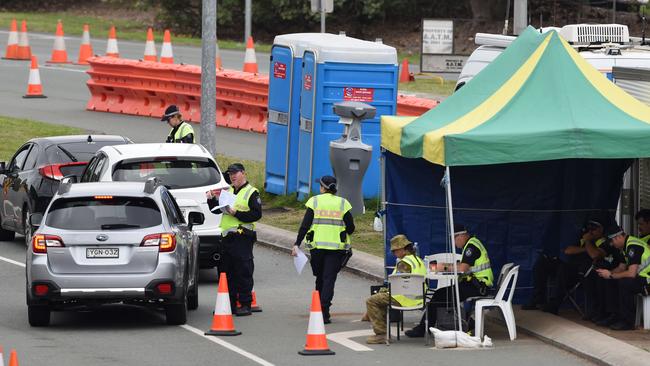 Police check cars at the Queensland border with NSW. Picture: Steve Holland