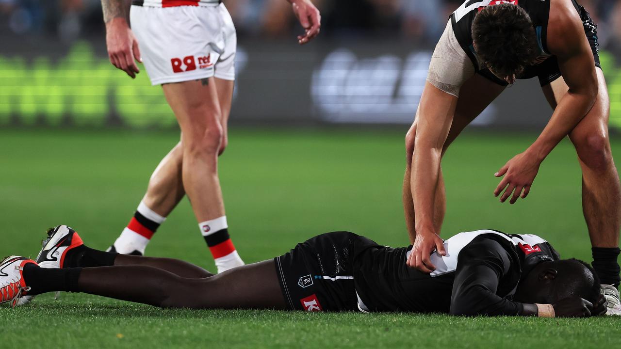 Aliir stayed down for a long time before being helped from the field. (Photo by James Elsby/AFL Photos via Getty Images)