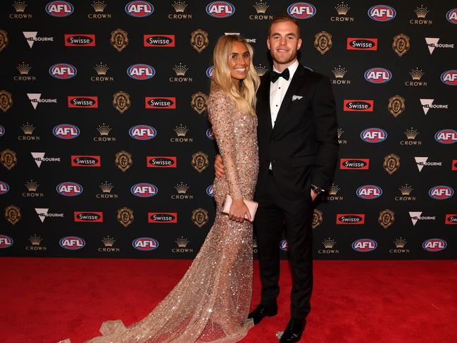 Hot Brownlow Medal fancy Tom Mitchell of Hawthorn and partner Hannah Davis. Picture: AAP