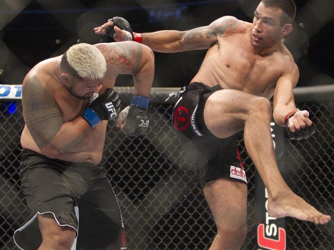 Mark Hunt battles against Brazil's Fabricio Werdum during a UFC 180 interim Heavyweight title fight in Mexico City