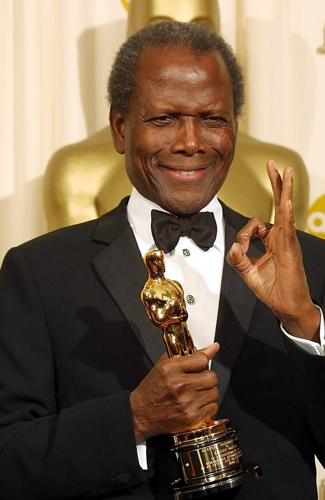 Sidney Poitier with his honorary Oscar Award in 2002.
