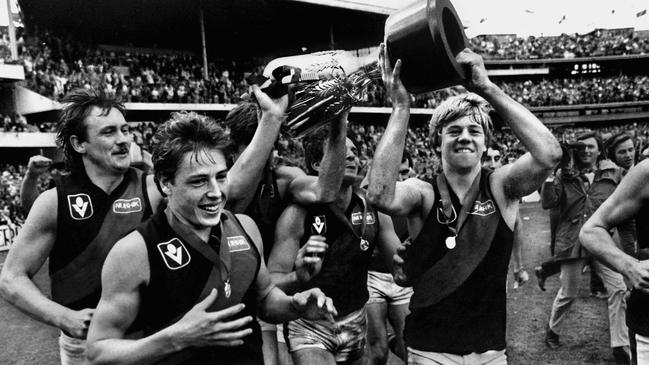 29/09/1984 PIRATE: Mark Thompson, Mark Harvey and teammates with the premiership cup. 1984 Grand Final. Essendon v Hawthorn. MCG.