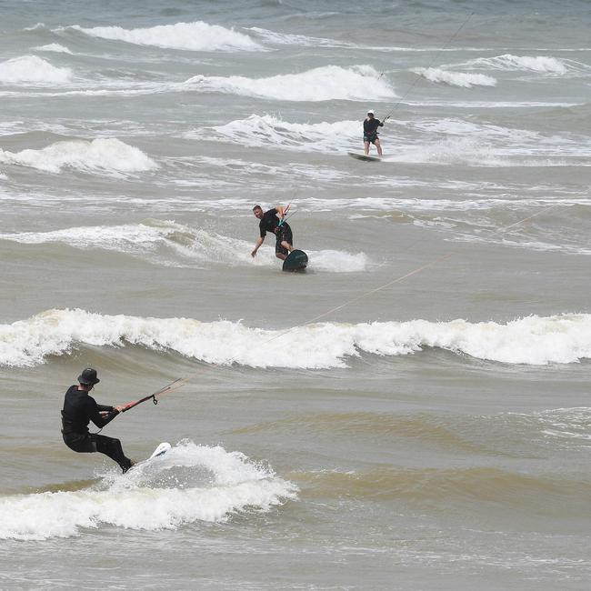 Kite surfers Trent Cotter, Eddie Morgan, and Tony James take advantage of the surf in Nightcliff. Picture: Katrina Bridgeford