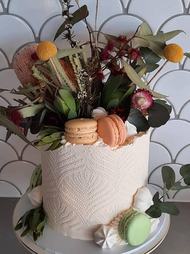 One of her glamorous cakes decoated with native florals for a client’s birthday.