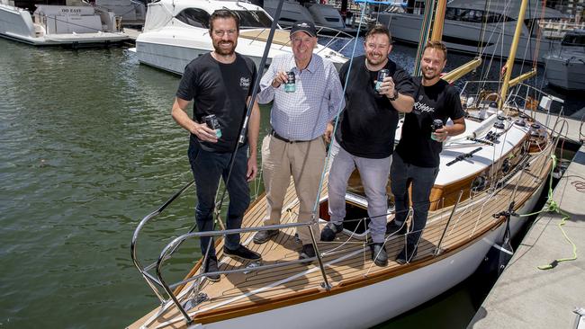 Gold Coast boat builder Bill Barry-Cotterwith Black Hops Brewing co-founders, Dan Norris, Michael McGovern and Eddie Oldfield aboard Katwinchar. Picture: Jerad Williams.