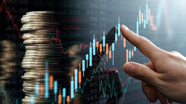 Analyst pointing candlestick chart; investing compound interest generic