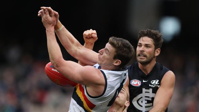 Adelaide’s Josh Jenkins attempts to mark as Carlton’s Levi Casboult. Picture: AAP